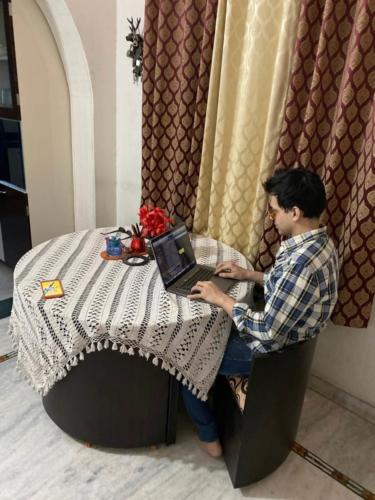 A Blind boy using a MAC book